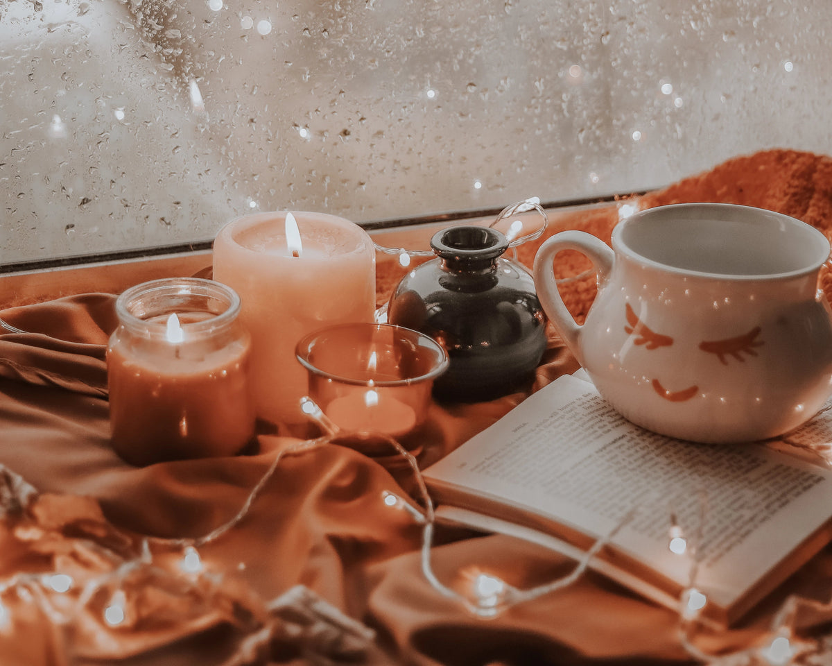 Autumn house scene with handle mug and candles
