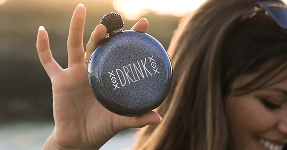 woman holding a brumate glitter flask with personalized name engraved into the finish