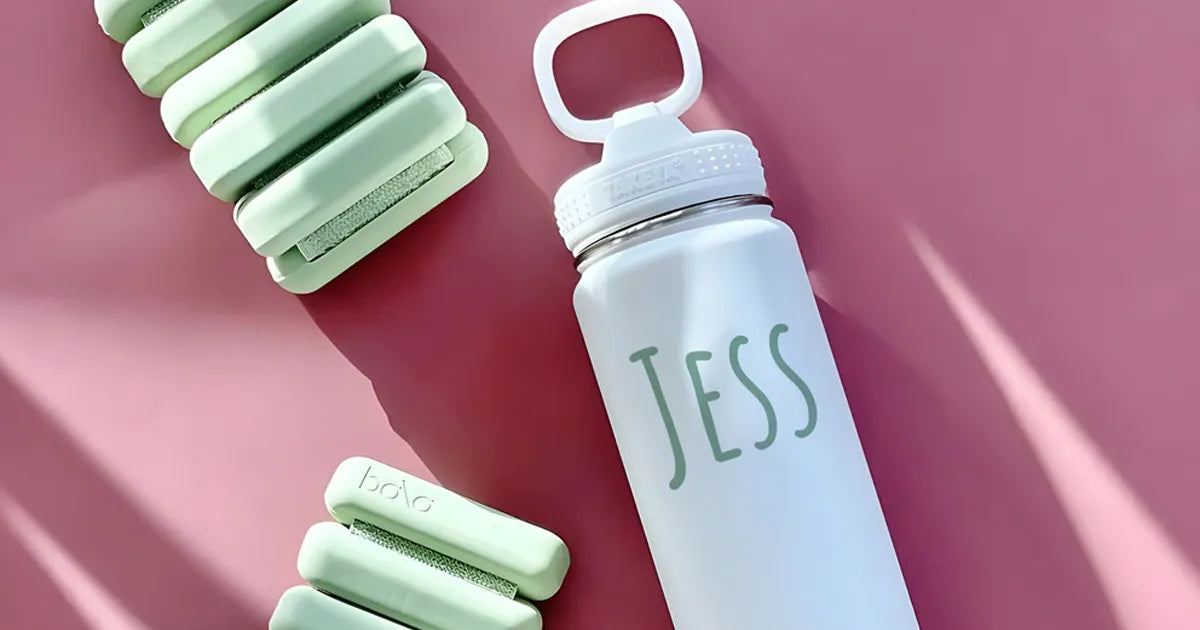 personalized takeya actives water bottle on a yoga mat
