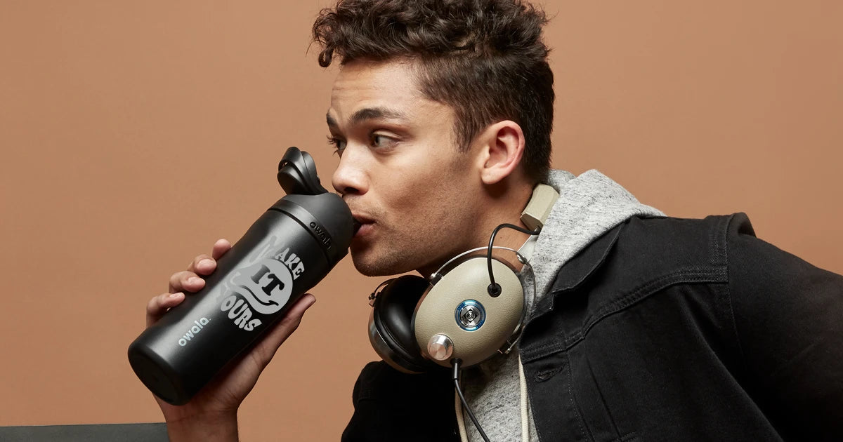 man drinking from a personalized owala freesip