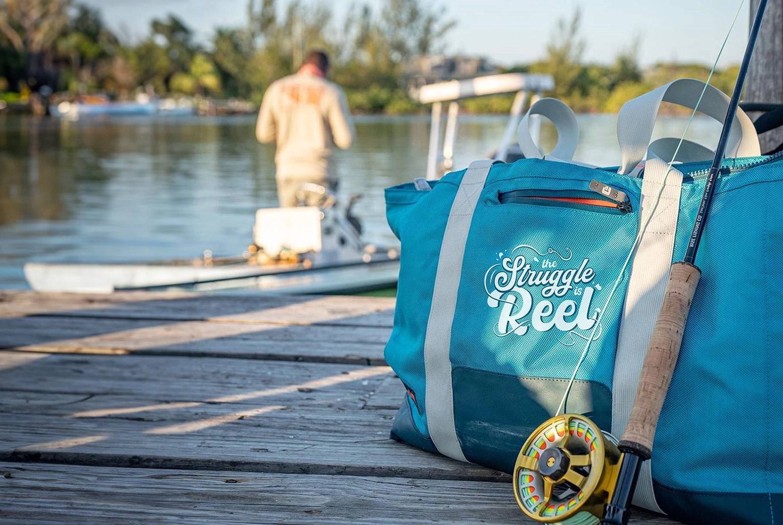 Grizzly soft cooler tote on a fishing pier with a personalized design.