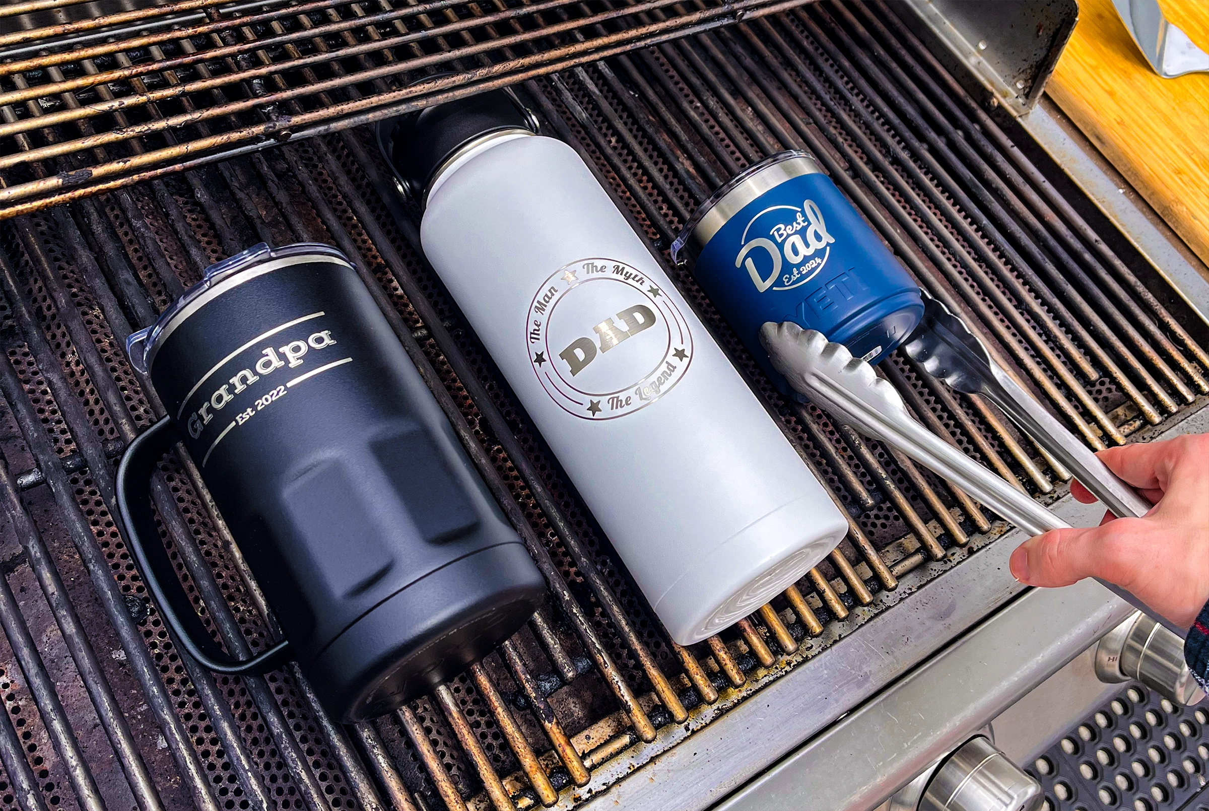 engraved mug and bottle on a grill personalized for father's day
