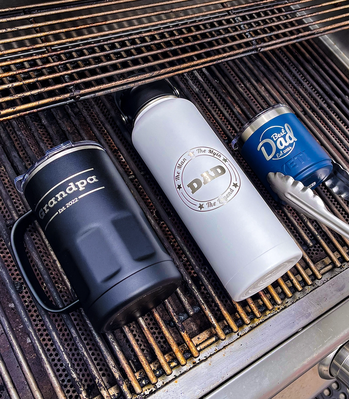 engraved mug and bottle on a grill personalized for father's day