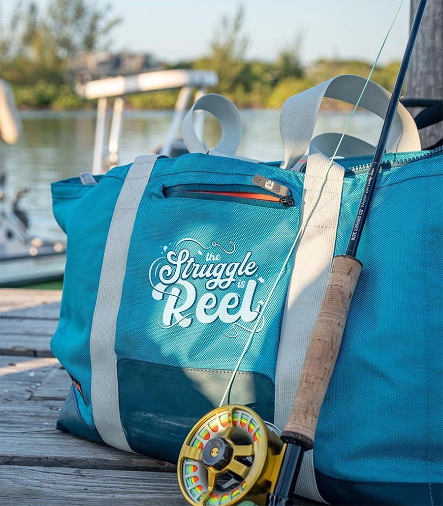 Grizzly soft cooler tote on a fishing pier with a personalized design.