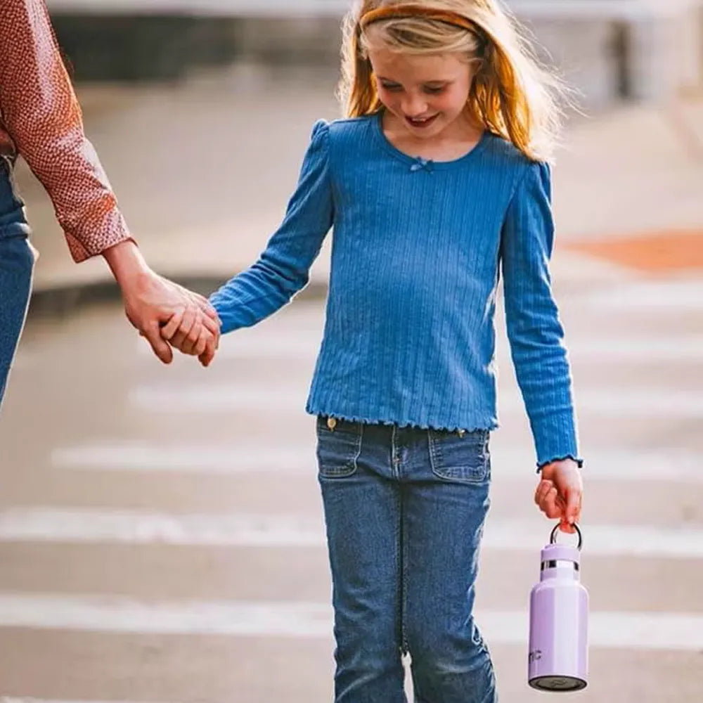 Girl carrying RTIC Little Journey Bottle.