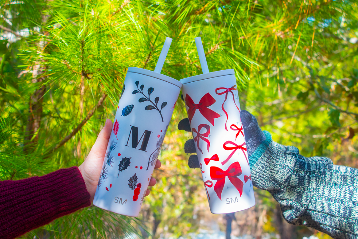 Two people cheersing with Custom Branding Winter Wrap Straw lid tumblers