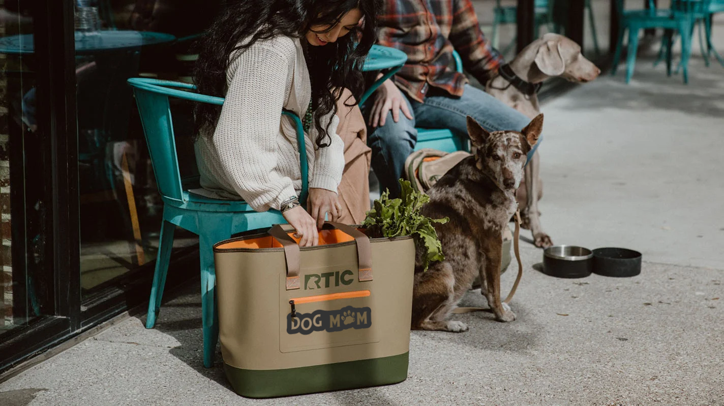 Woman Reaching into the RTIC Ultra Tough Tote