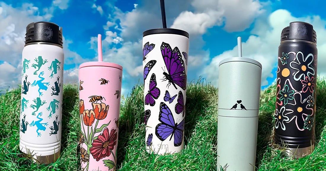 Easter themed custom printed tumblers and bottles on a grassy hill