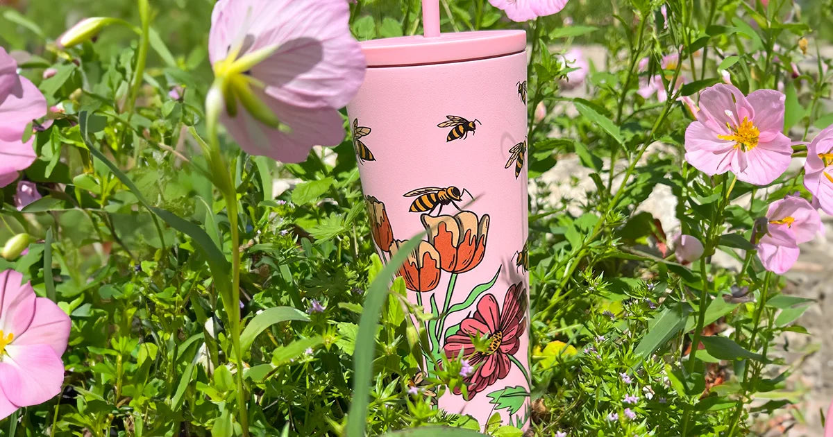 classic straw tumbler wrap butterfly design, in a garden of pink primrose