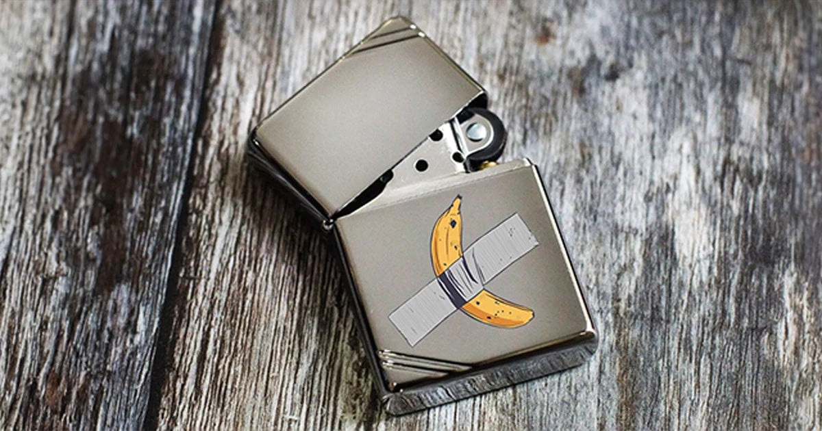 Zippo high polish chrome lighter with custom print of a banana taped to it
