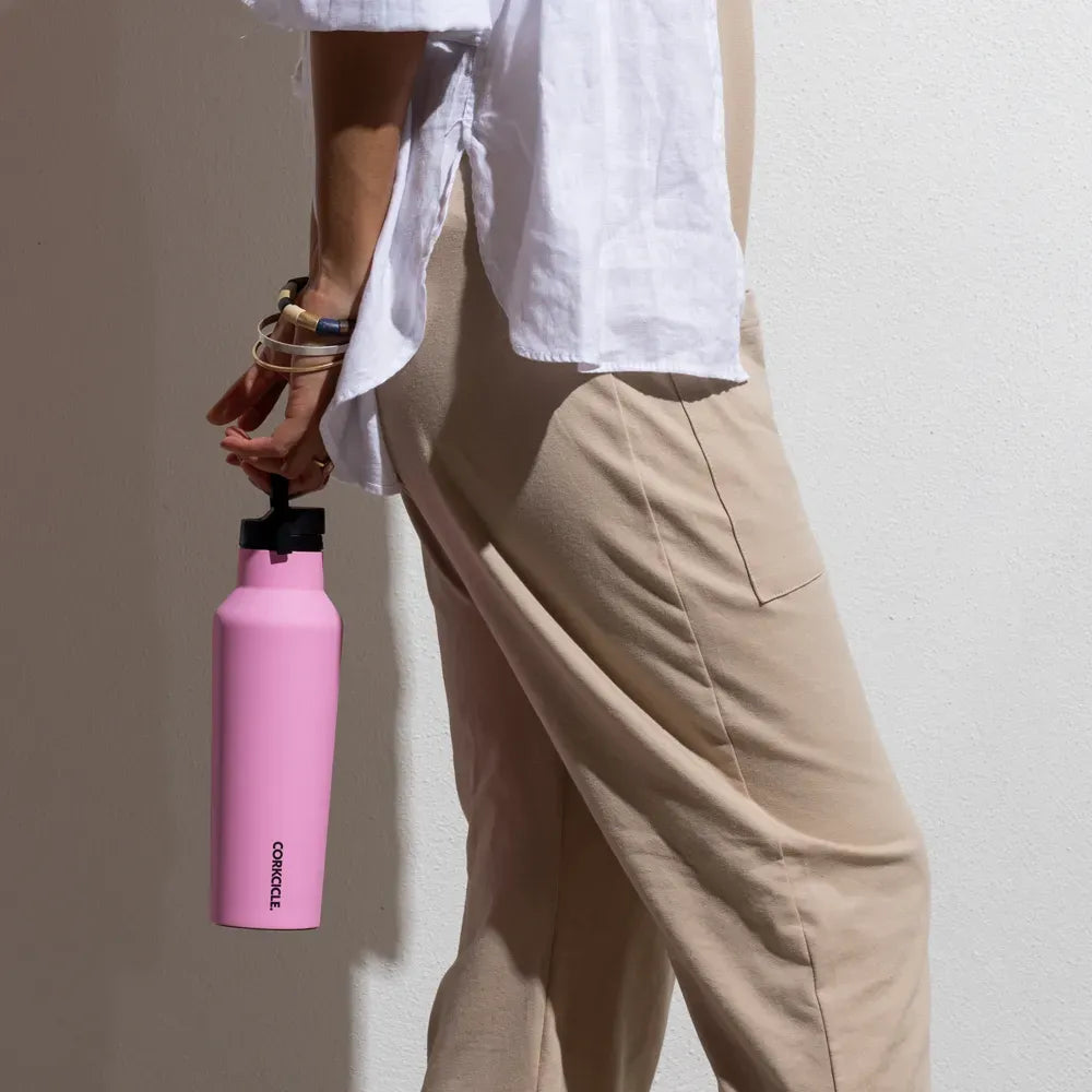 Person carrying Corkcicle Sport Canteen while walking. 