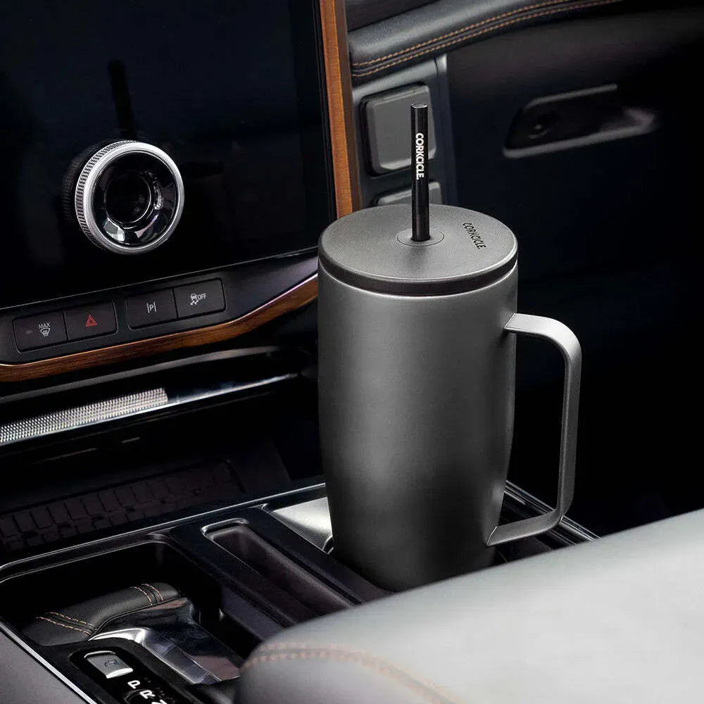A Corkcicle 30 oz Cold Cup XL tumbler in car cupholder.  