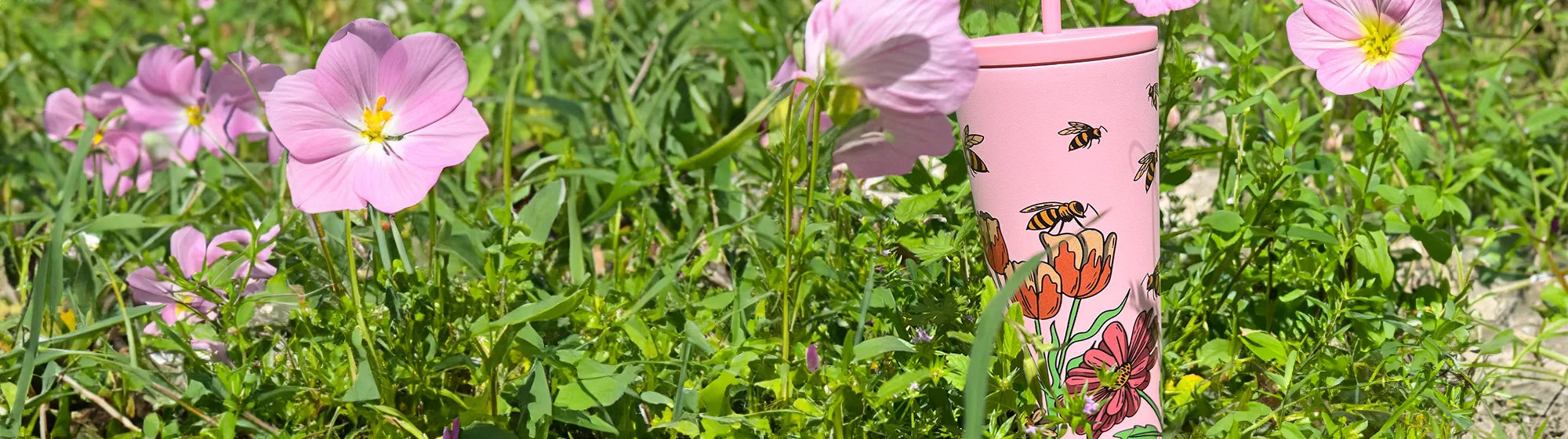 classic straw tumbler wrap butterfly design, in a garden of pink primrose