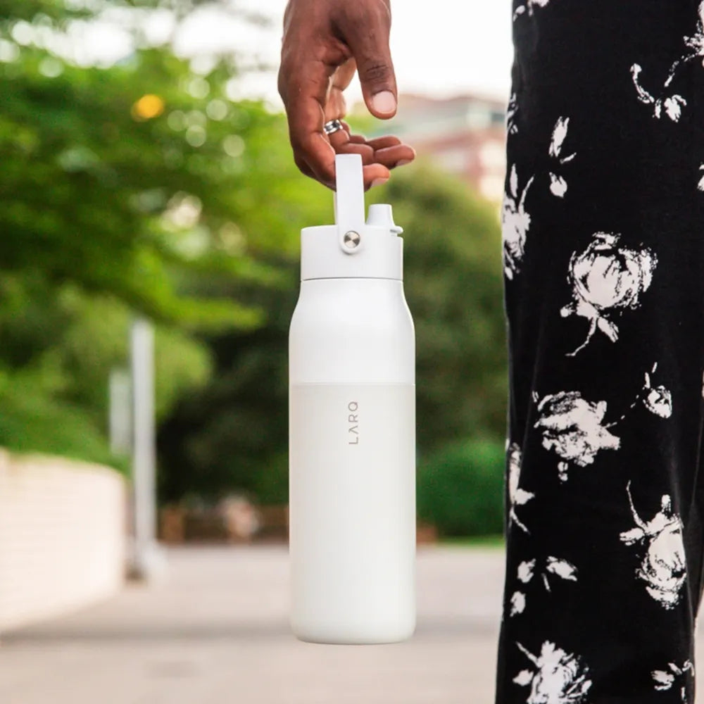 Man holding Larq 34 oz Swig Top Bottle