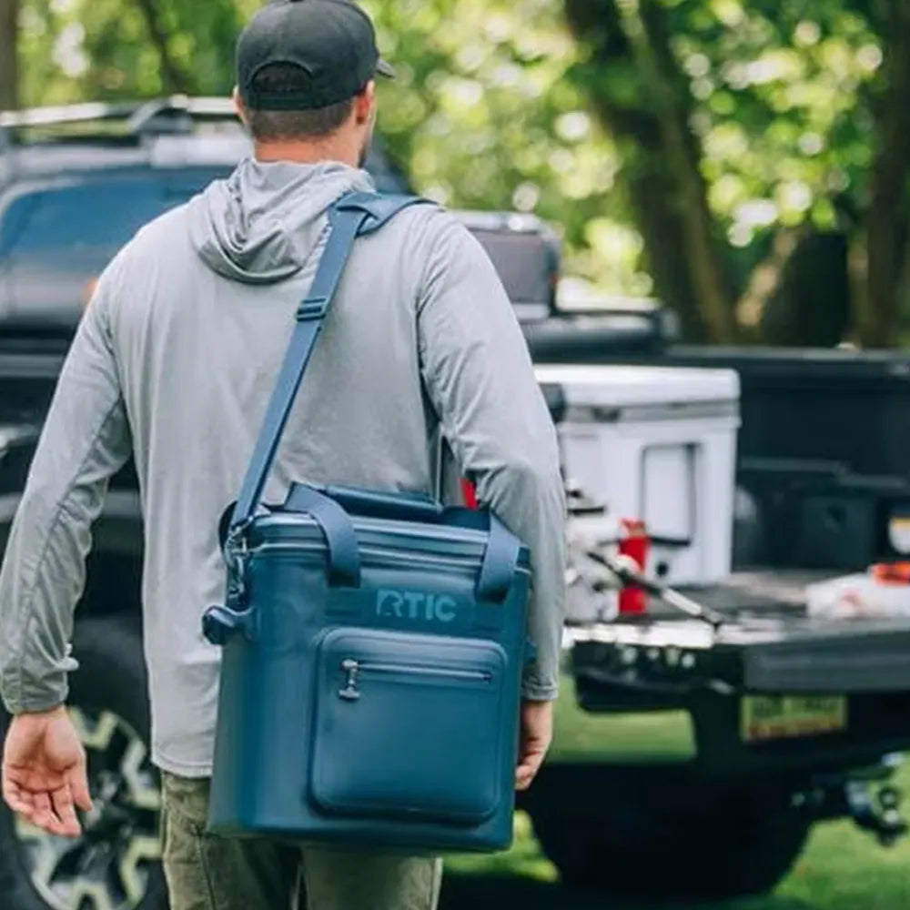 Man carrying RTIC Ultra-Tough Soft Cooler Pro.