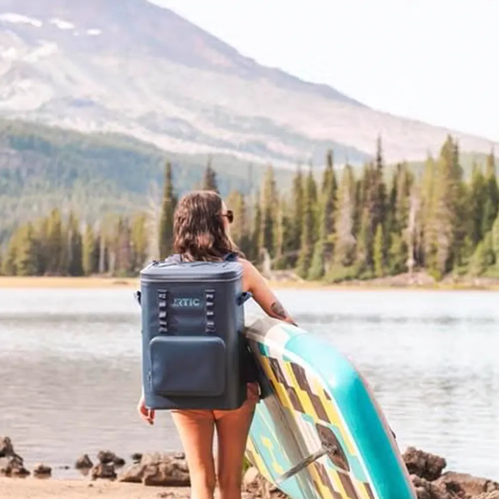 Woman carrying Ultra-Tough Backpack Cooler.