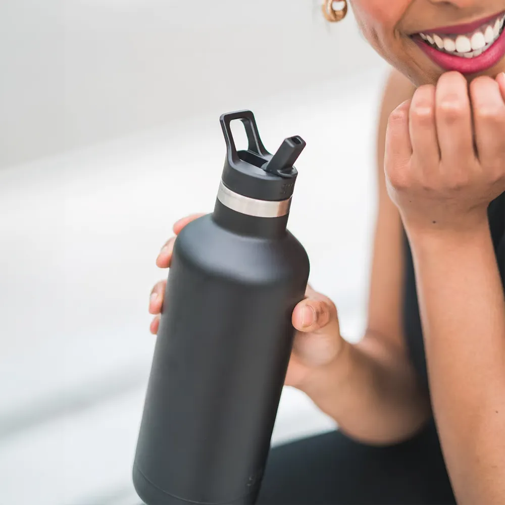 Woman holding Simple Modern Ascent Water Bottle