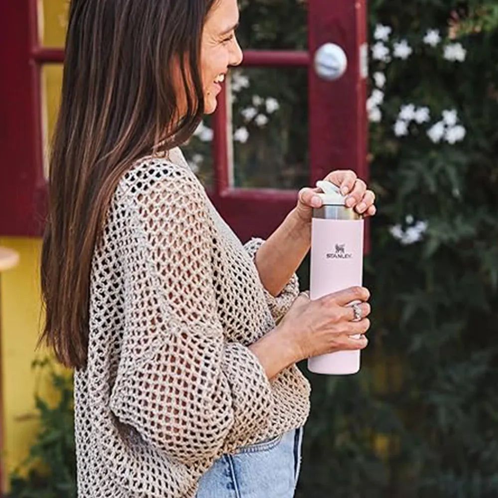 Woman holding 20 oz Stanley AeroLight Bottle