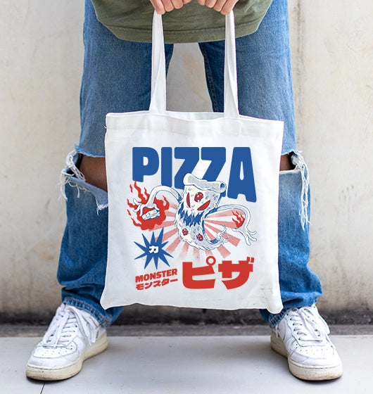 Person holding custom tote bag with printed design of a japanese pizza monster
