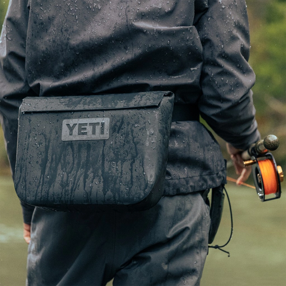 Person wearing 6 liter Yeti SideKick while fishing.