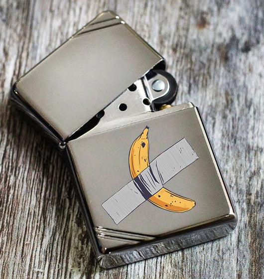 Zippo high polish chrome lighter with custom print of a banana taped to it