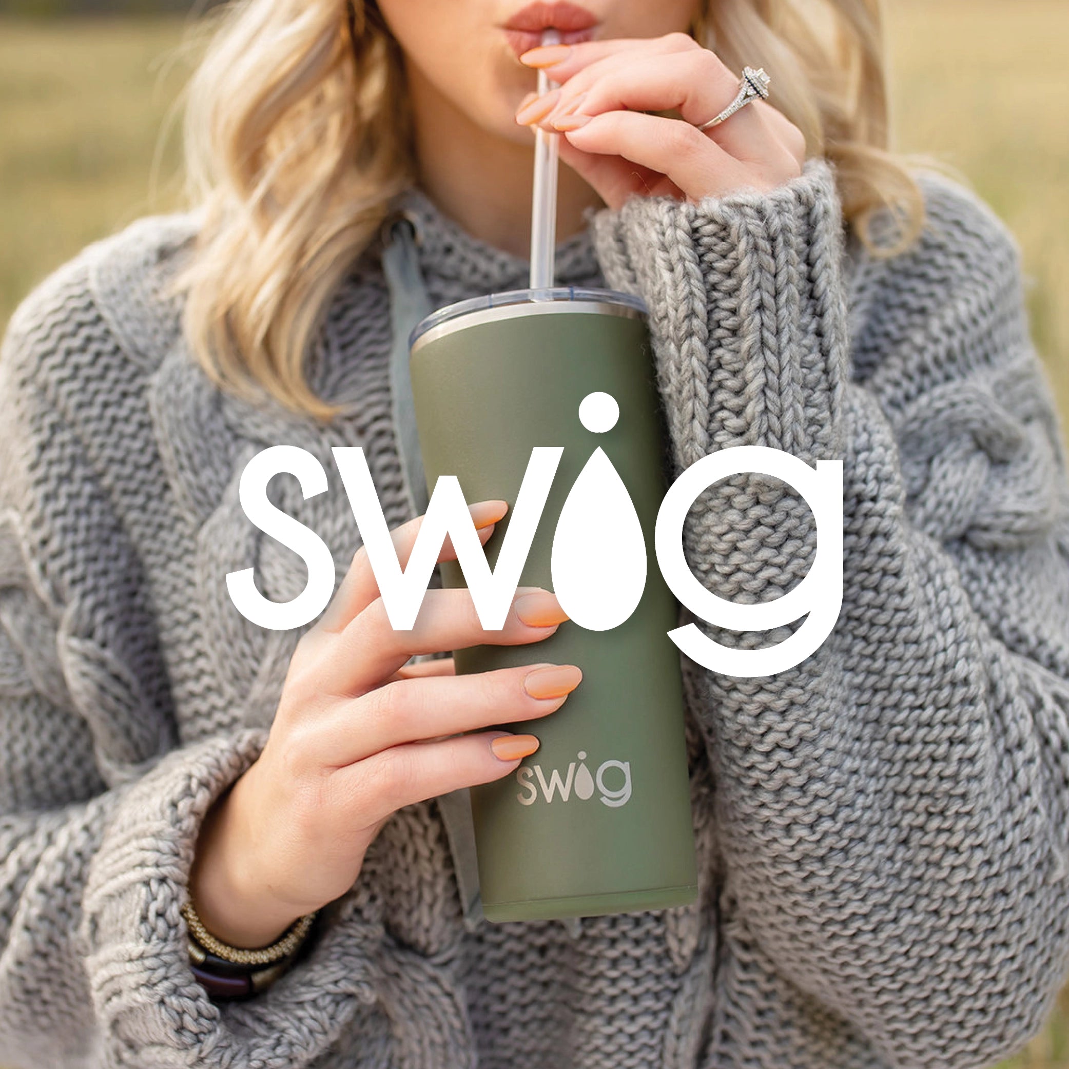 Woman sipping from green Swig tumbler through clear straw