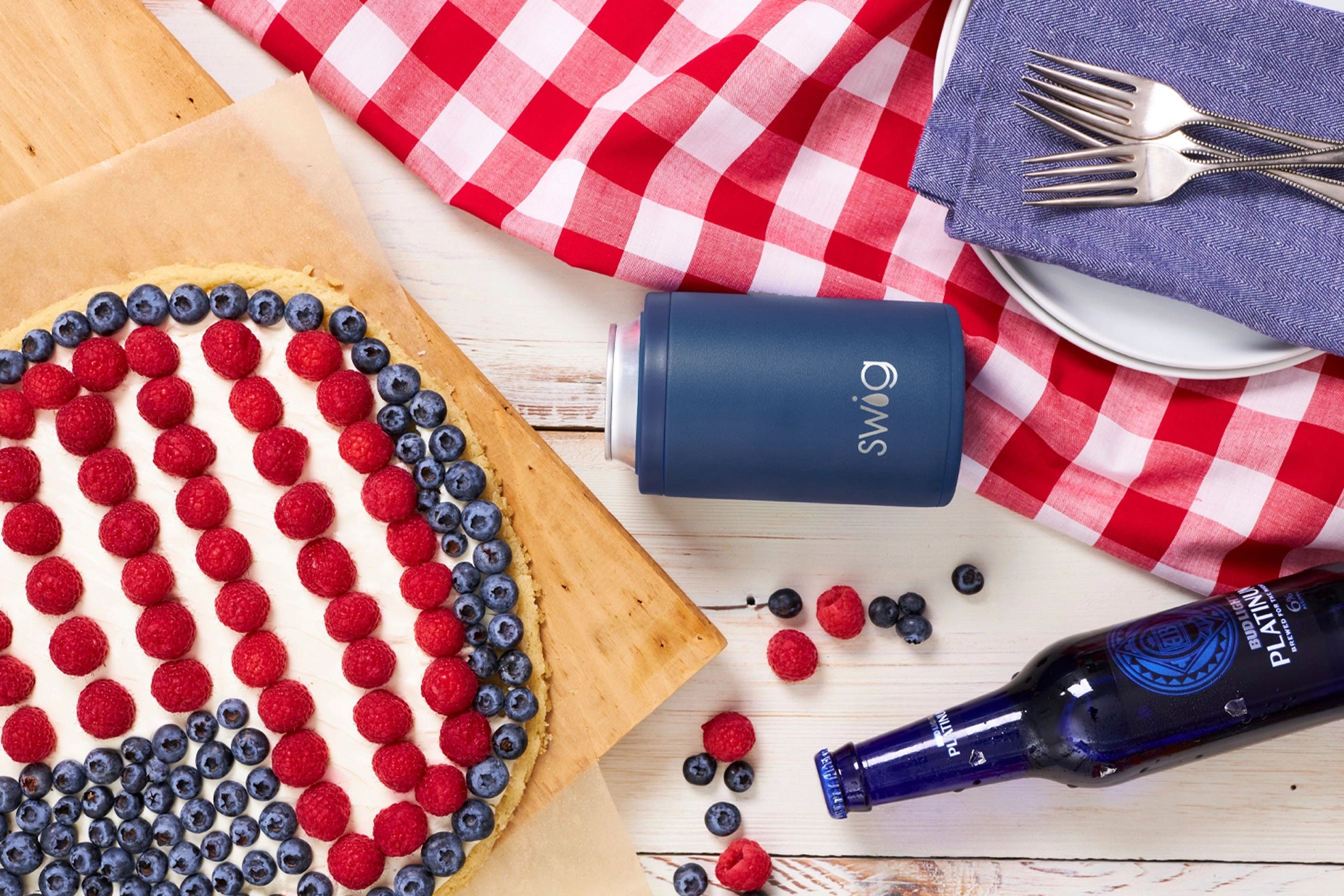 July 4th banner with fruit pie that has American flag design and swig can holder koozie in blue