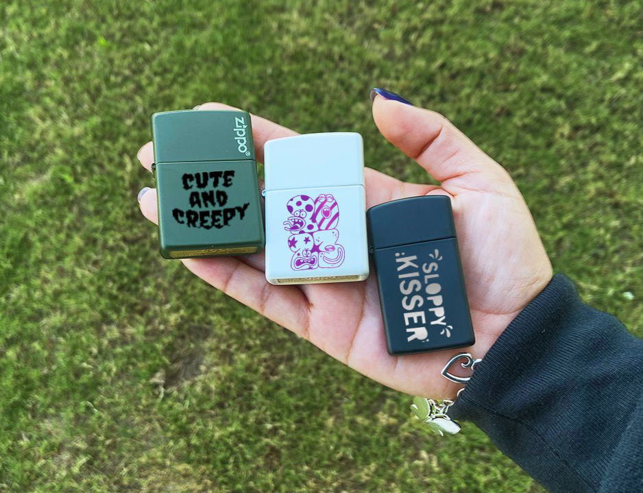 customized zippo lighters with matte color finishes being held in hand