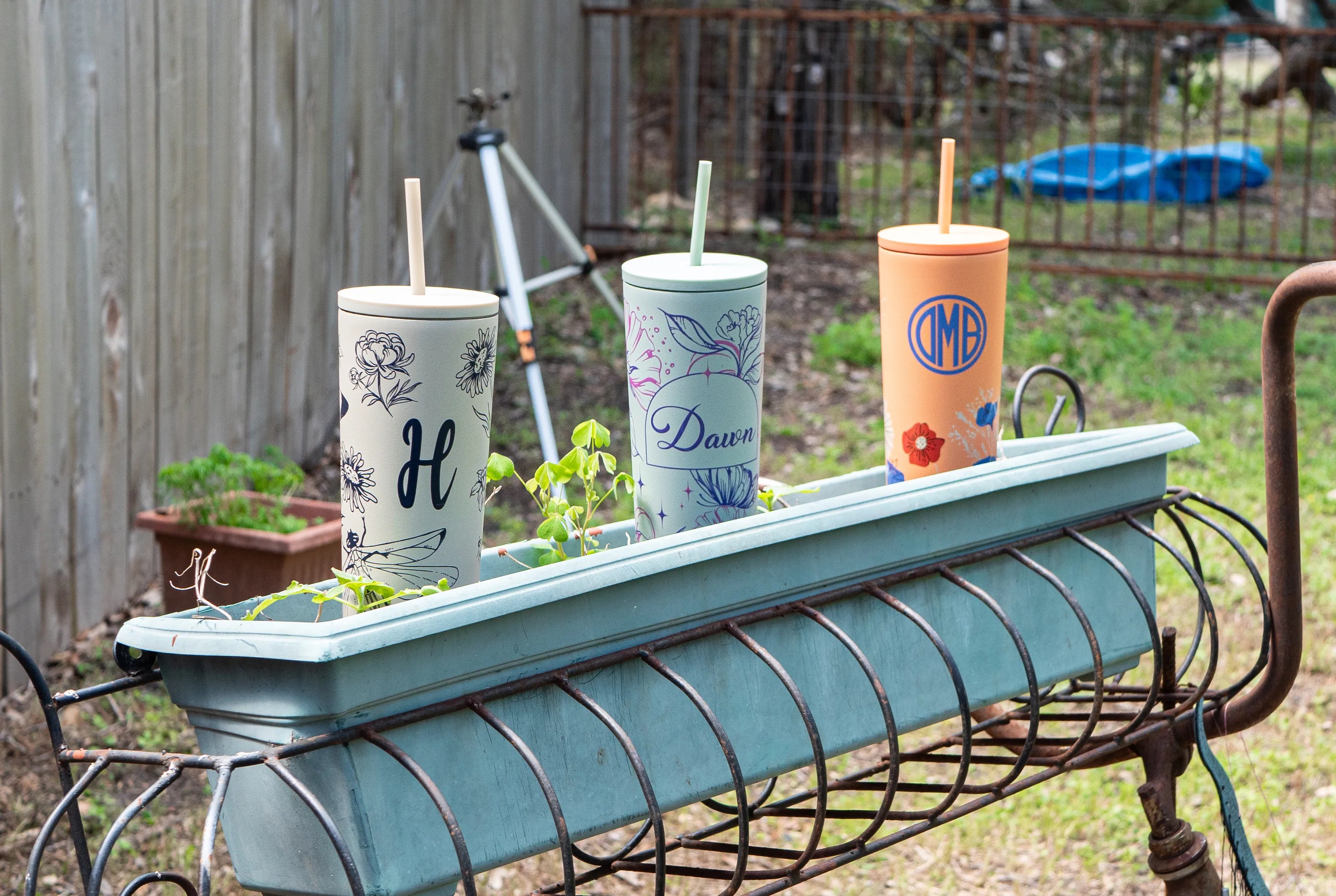 garden scene with personalized mothers day straw tumblers