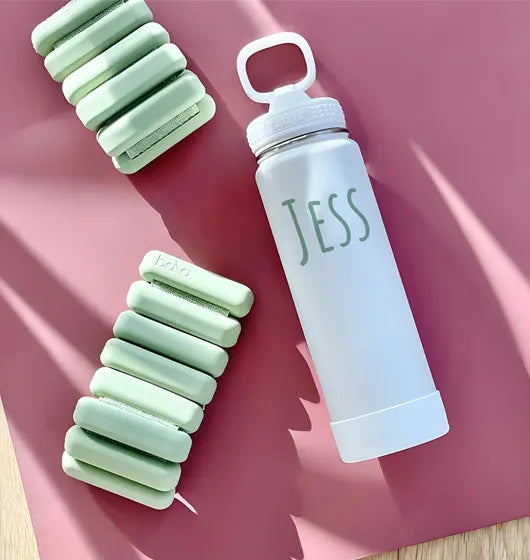 personalized takeya actives water bottle on a yoga mat