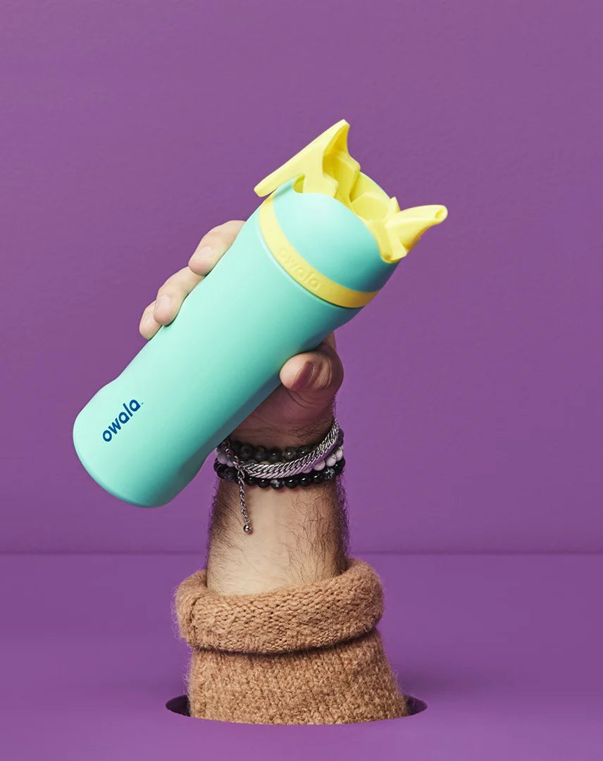 Green and yellow Owala flip water bottle