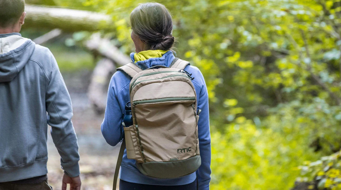 Tan RTIC roadtrip backpack being worn on a hike